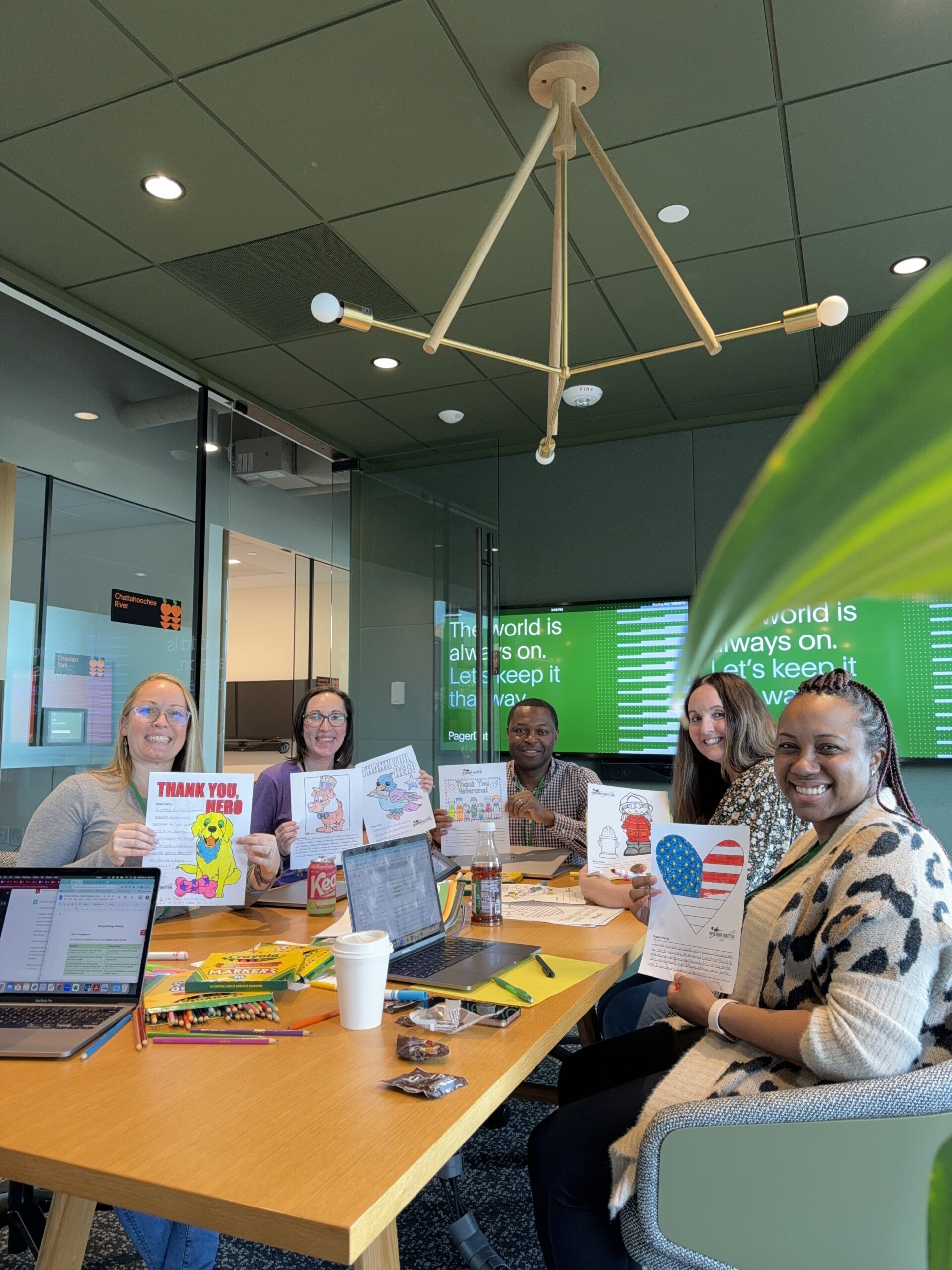Image of group sending letters to military members