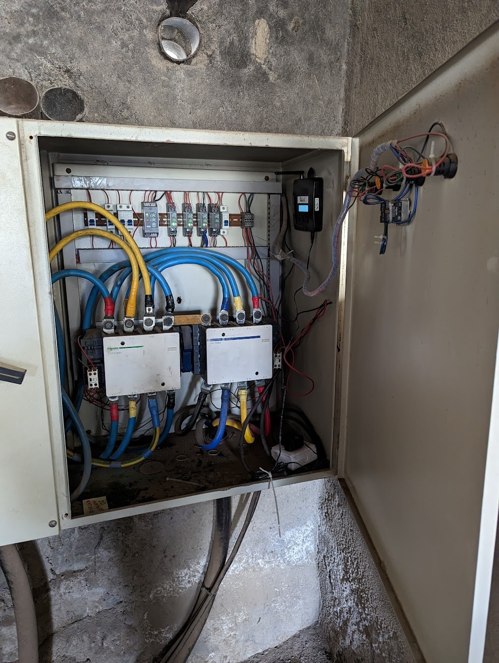 Nexleaf Analytics Photo of wall cabinet with wires and sensors