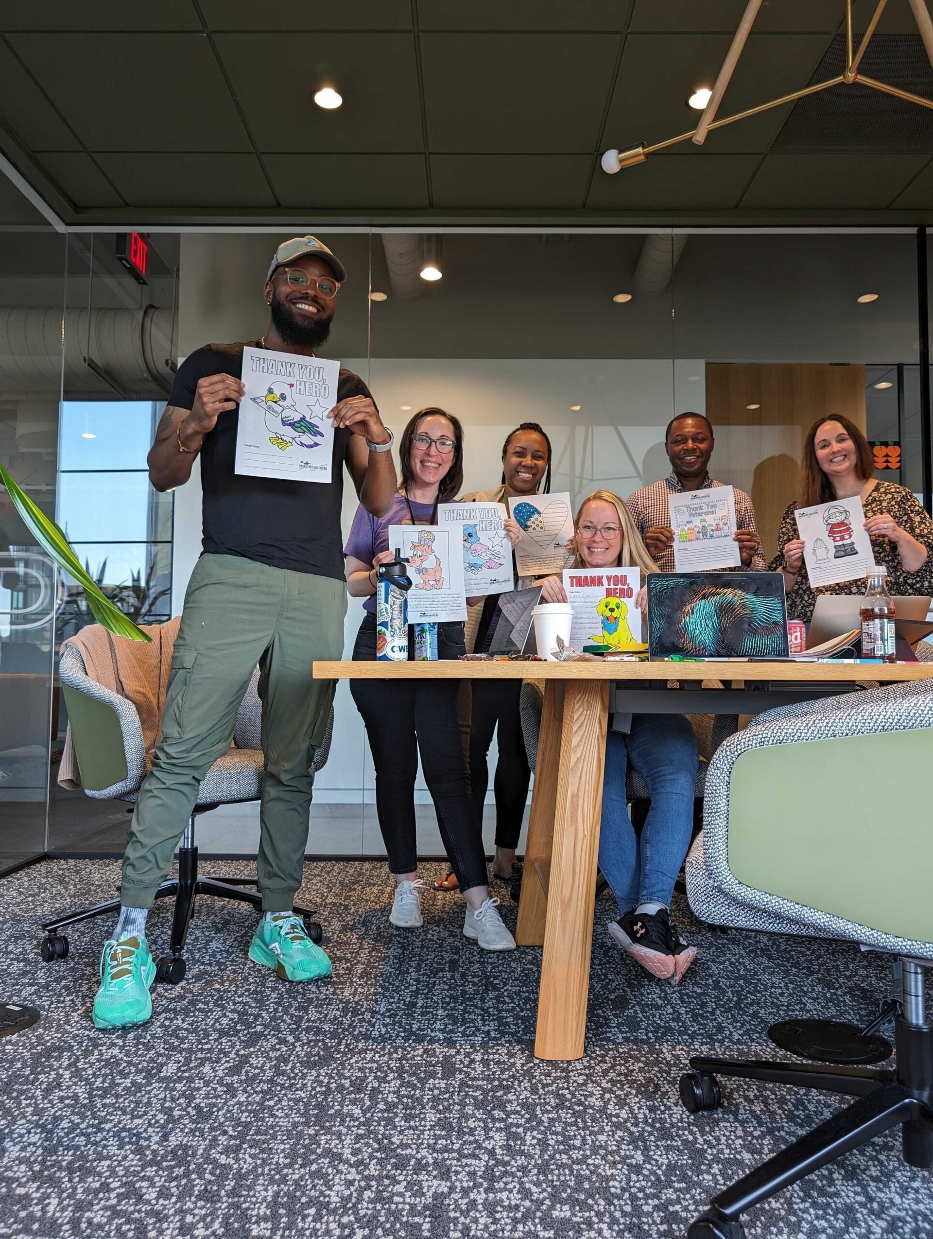 Image of group sending letters to military members