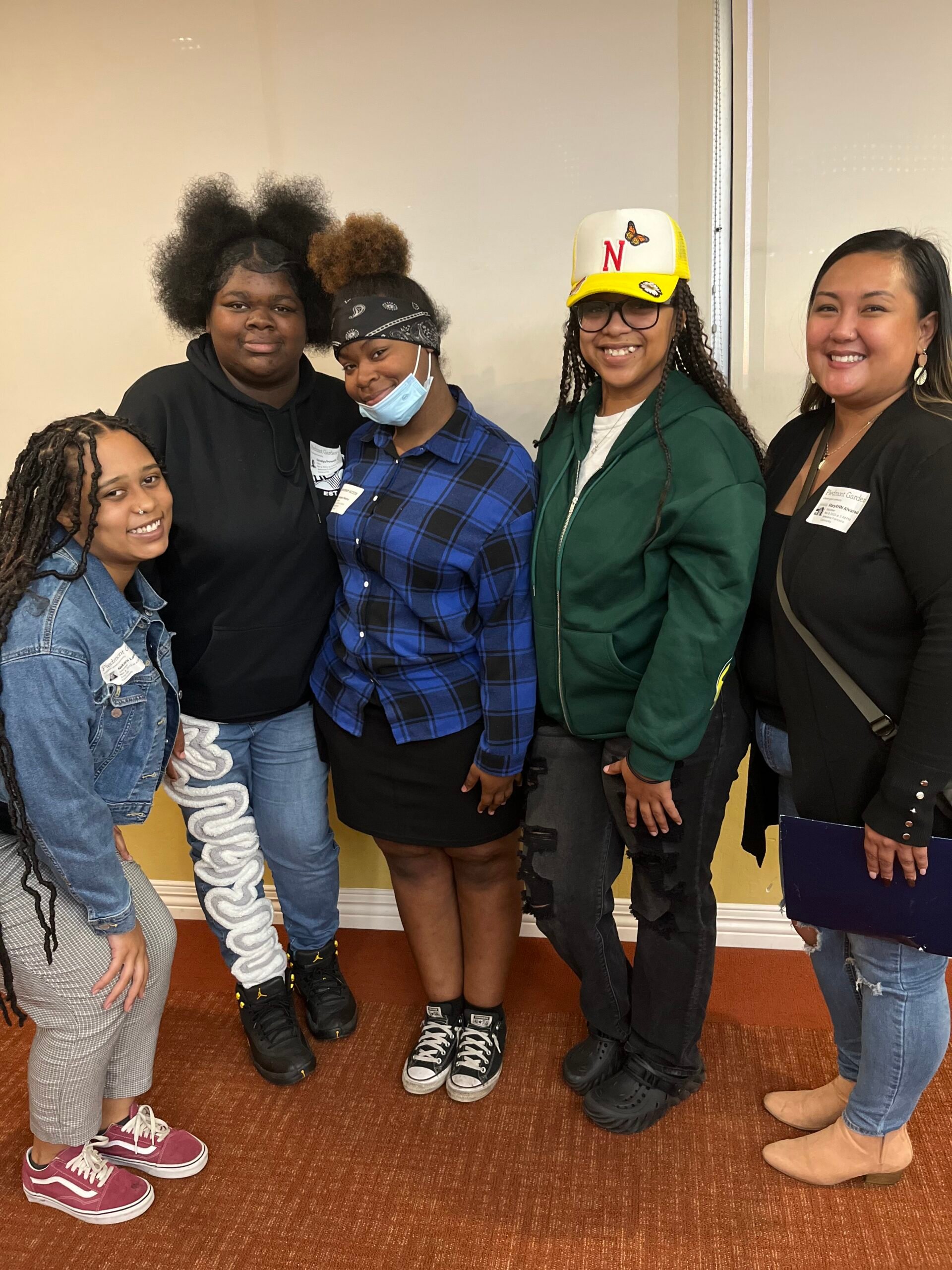 Youth ALIVE! Photo of five people standing in a semicircle and smiling towards the camera