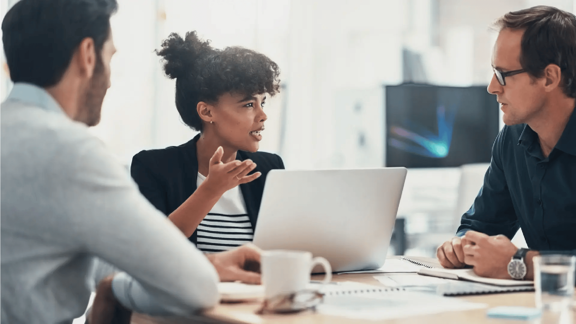 Three people in a meeting