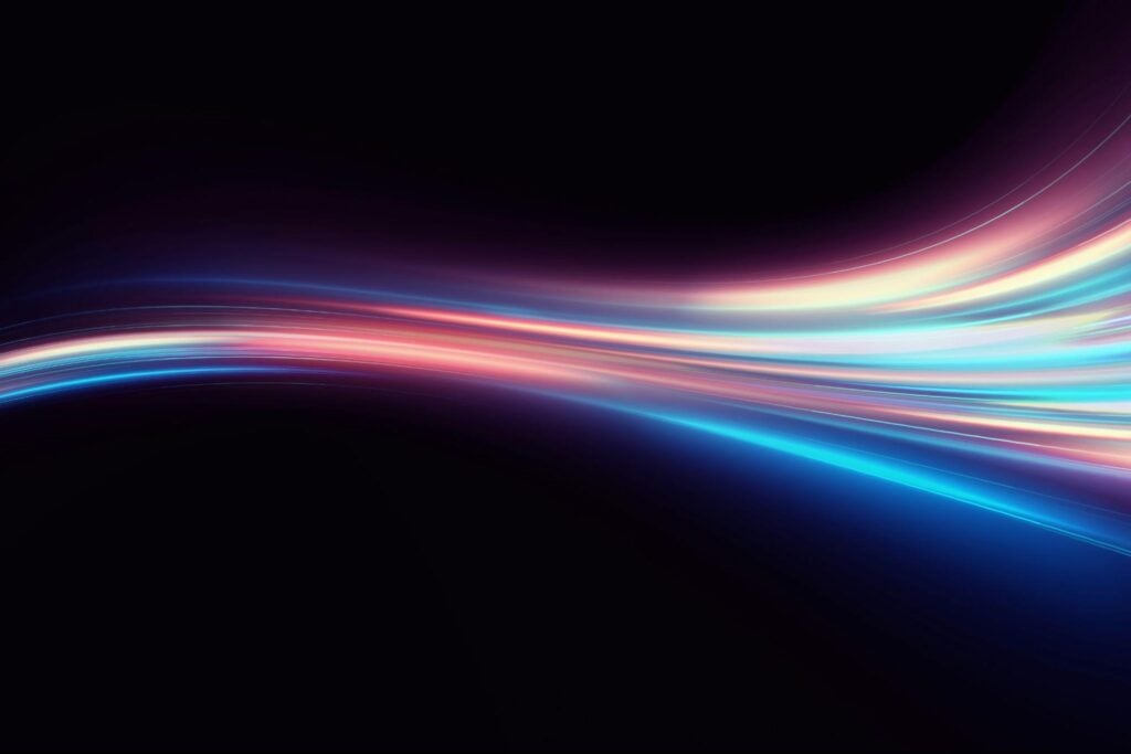 Rainbow light pattern on a black background.