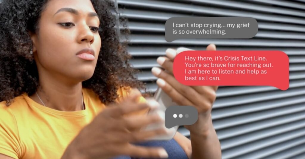 Young woman looking at her phone. Grey and red text bubbles illustrate the conversation she is engaged in.